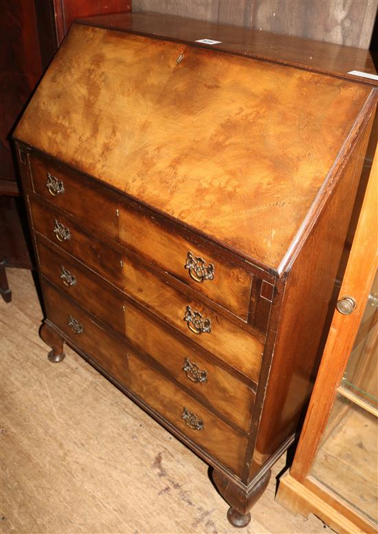 A 1930s banded walnut bureau, on short front cabriole legs